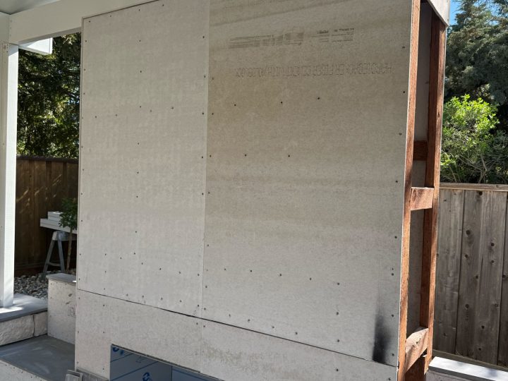 Outdoor fireplace wall ready for finish materials beneath the Danville covered patio.