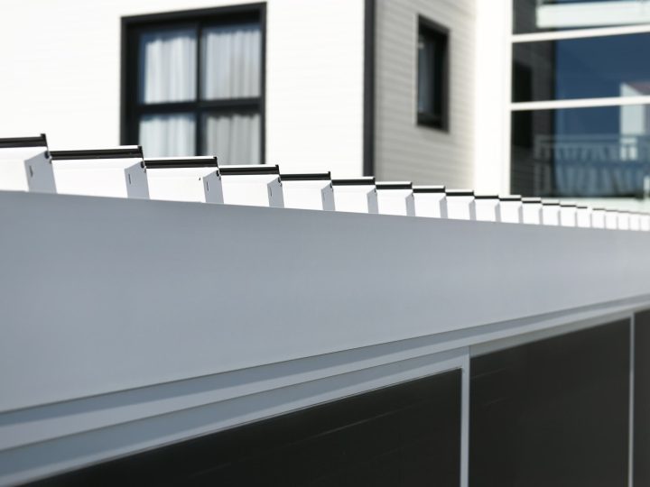 Close-up of Pergo Centro SO Climate motorized louver blades in a white pergola roof.
