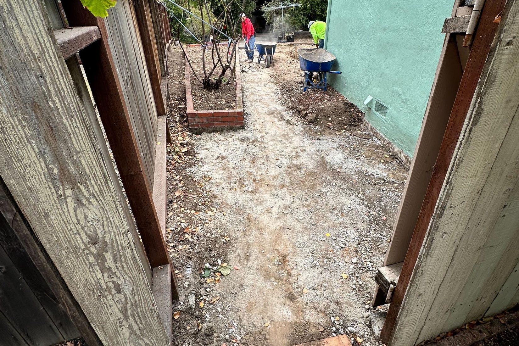 Martinez side yard during walkway preparation before the hardscape and patio cover project by FG Pavers and Turf.