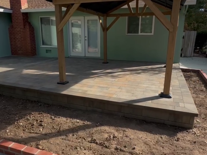 Wood gable patio cover over a raised paver patio in Martinez by FG Pavers and Turf.