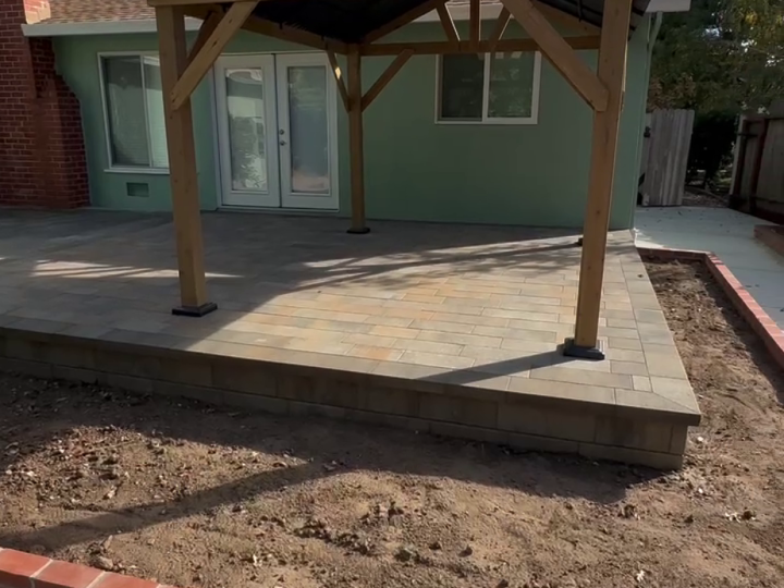 Front view of a wood gable patio cover over a Martinez paver patio by FG Pavers and Turf.